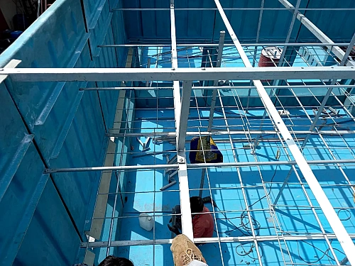 FRP cooling tower basin with support frame during installation