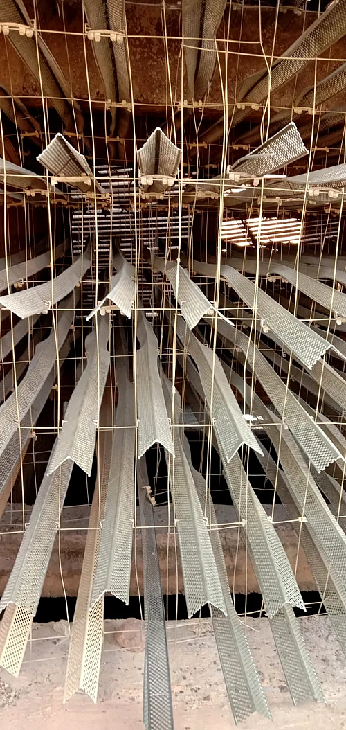 Splash bars hung on grids inside a cooling tower